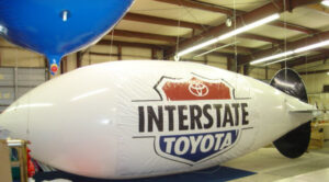 30ft white helium blimp with INTERSATE TOYOTA logo